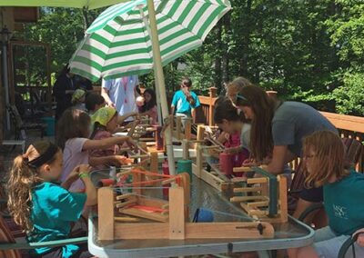 Weaving on Sacred Heart Lodge Deck