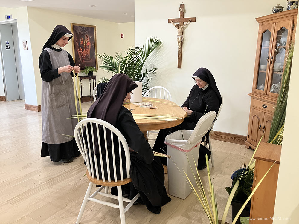 palmsundayprep26 Sisters prepare the palms for Palm Sunday.