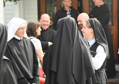 Postulants visit after the ceremony, September 8, 2026